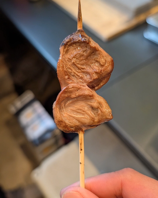 A finished heart skewer with two pieces of heart